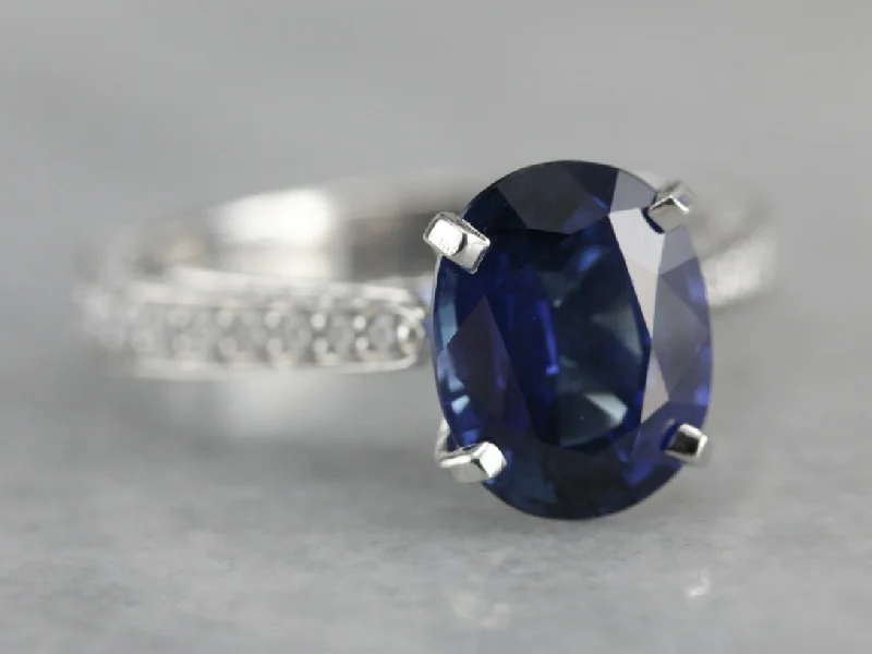 Ladies Engagement Rings Gold Halo-Luxurious Modern Sapphire and Diamond Engagement Ring in Platinum